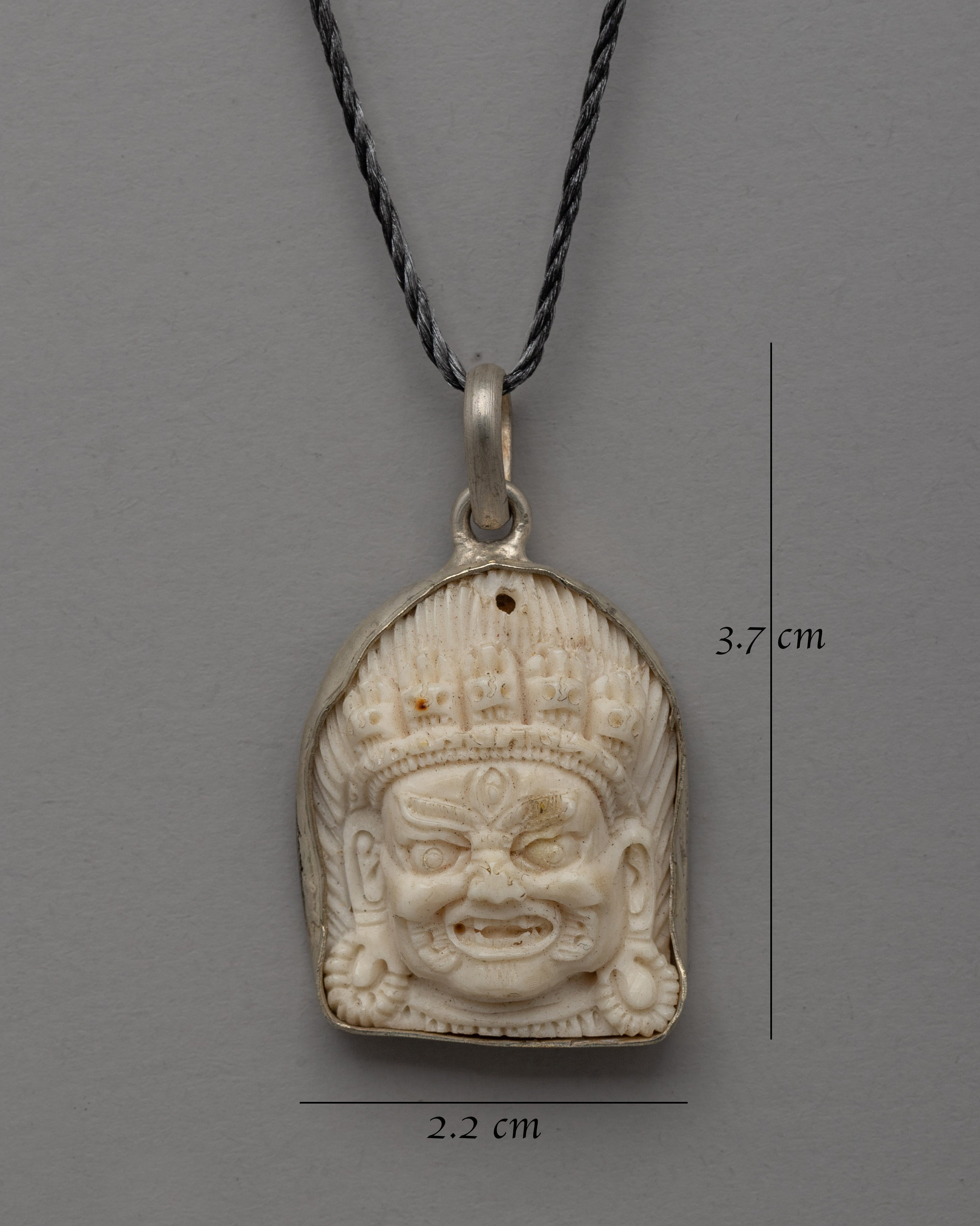 Hand-Carved Bhairav Locket with Five-Skull Crown | Buffalo Bone & White Metal