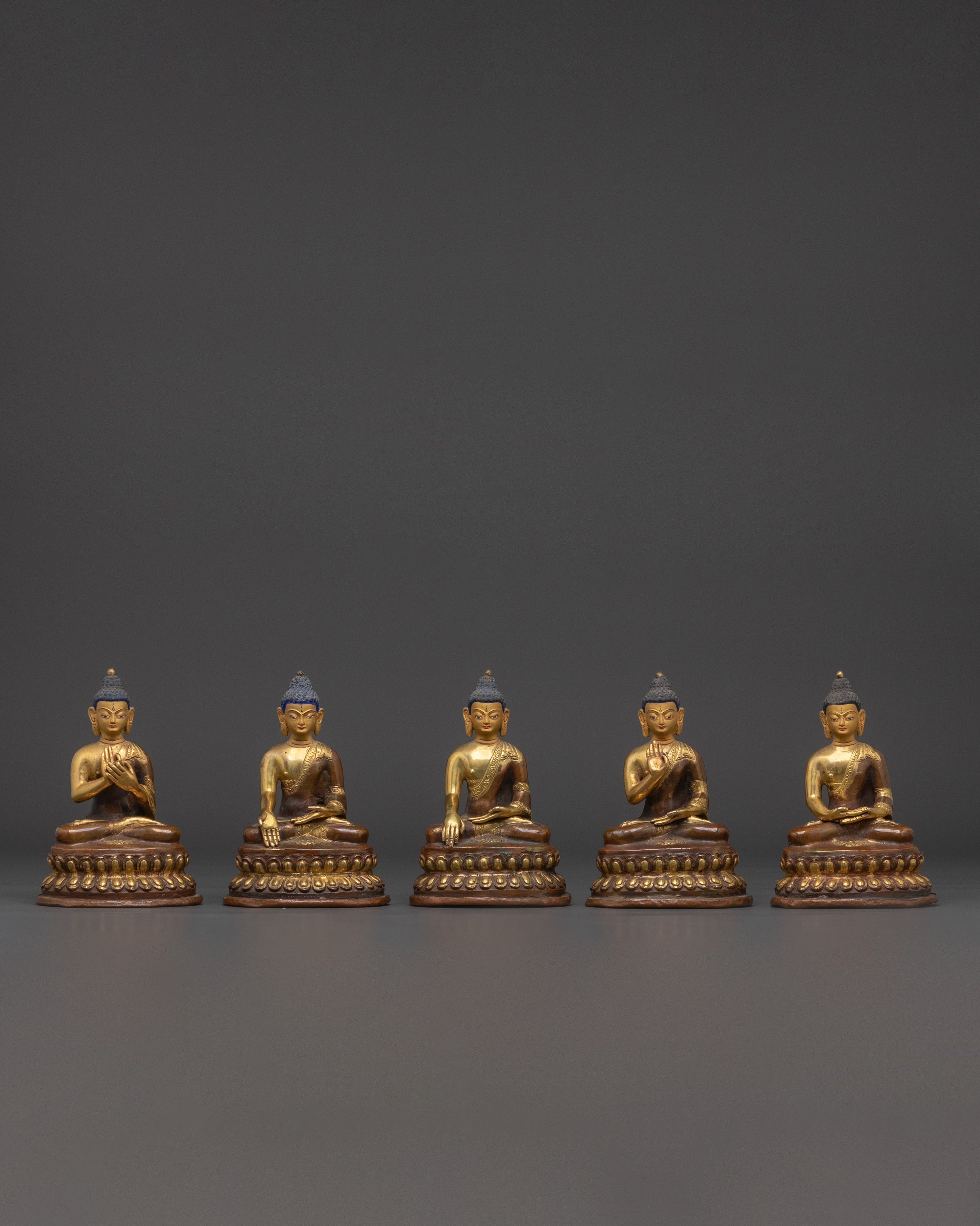 Set of Five Brass Buddha Statues