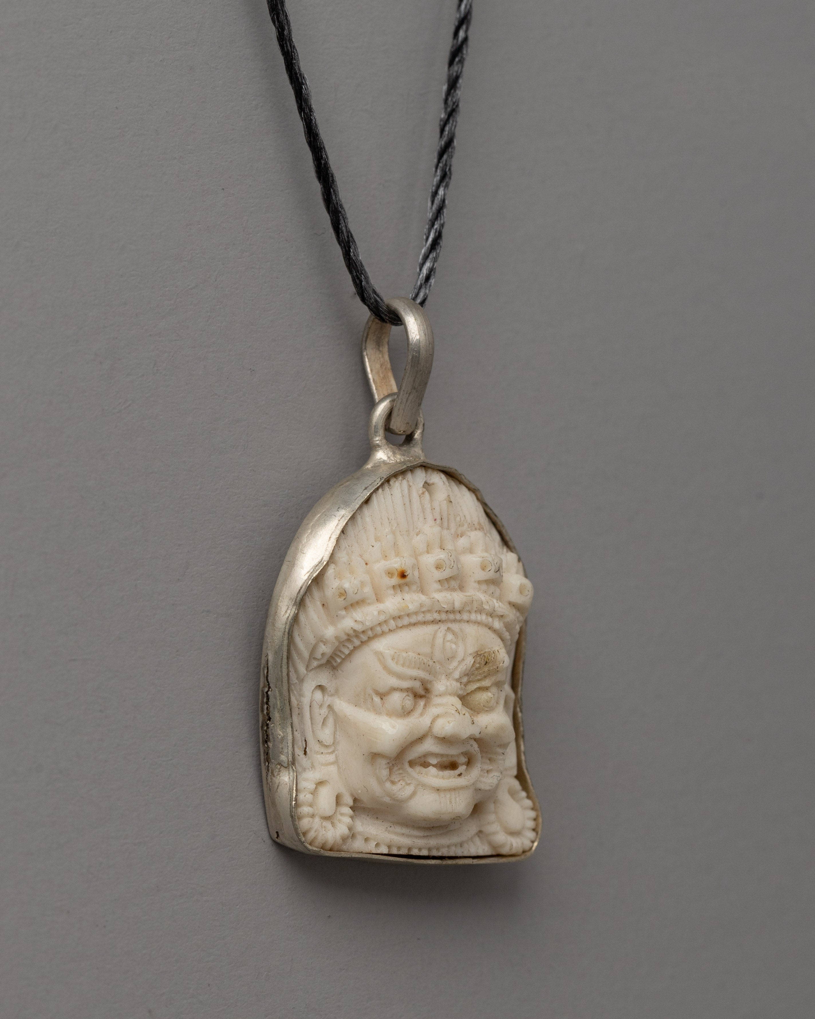 Hand-Carved Bhairav Locket with Five-Skull Crown | Buffalo Bone & White Metal