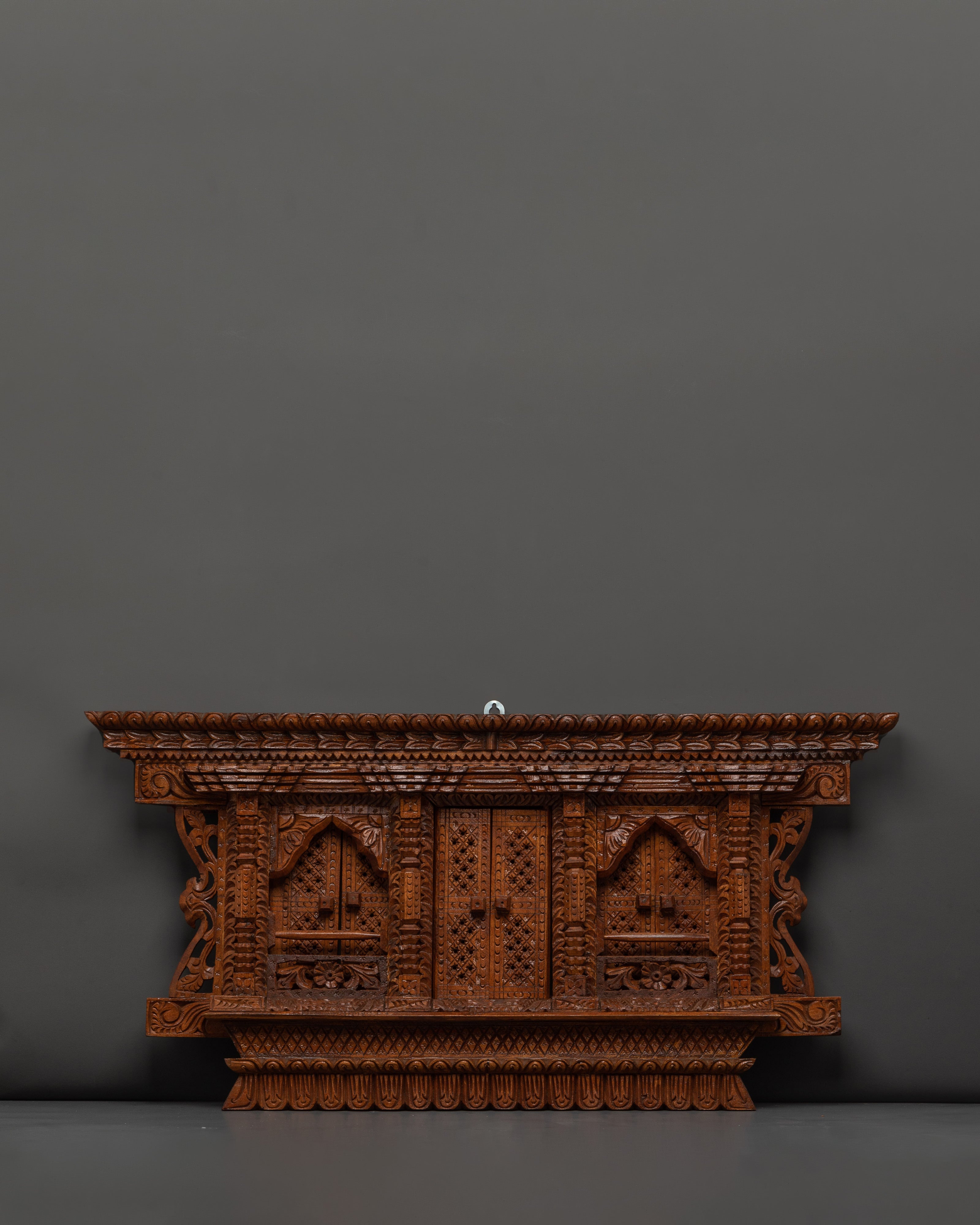 carved wood wall hanging