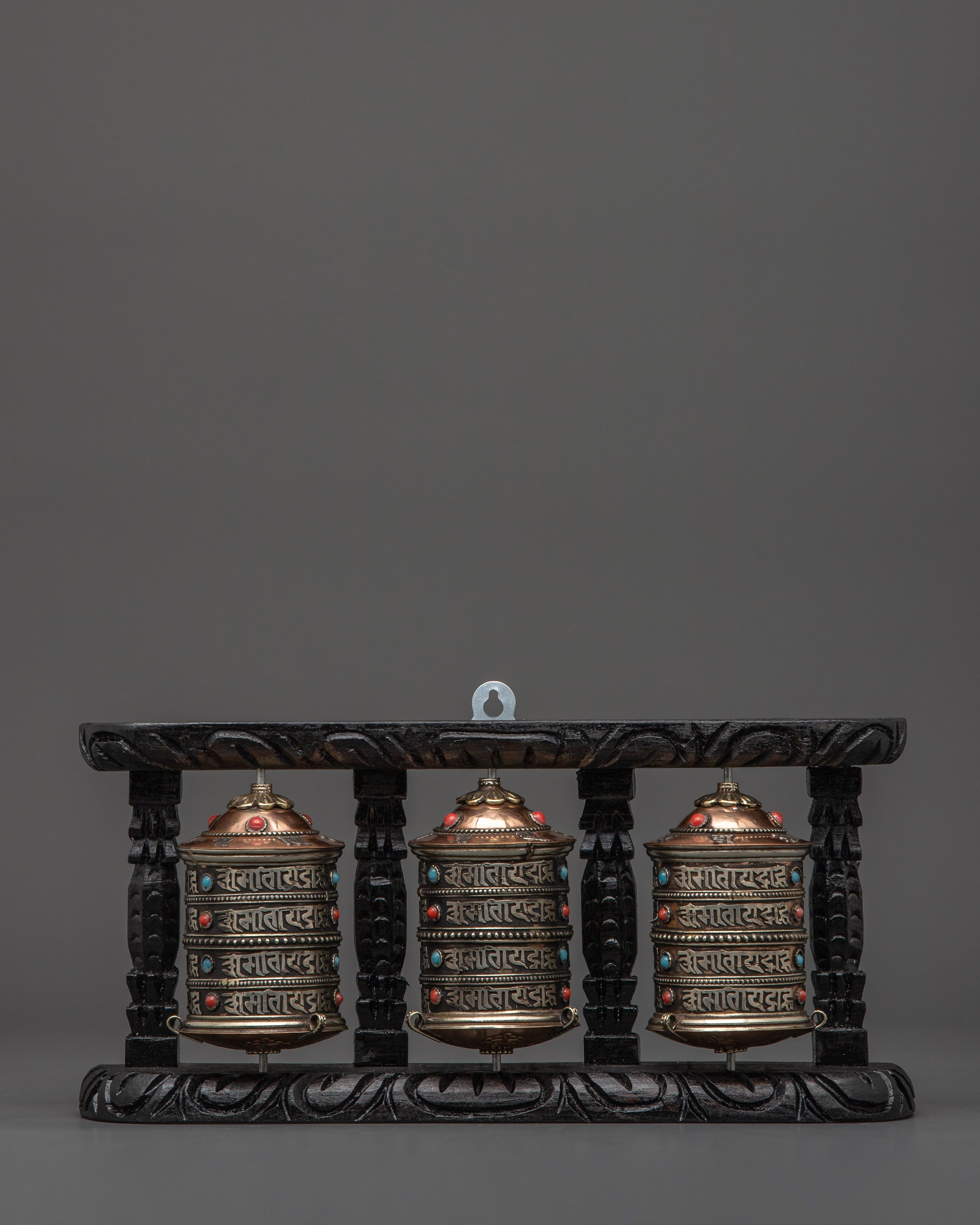 three-wheel-prayer-spinner-in-wooden-frame