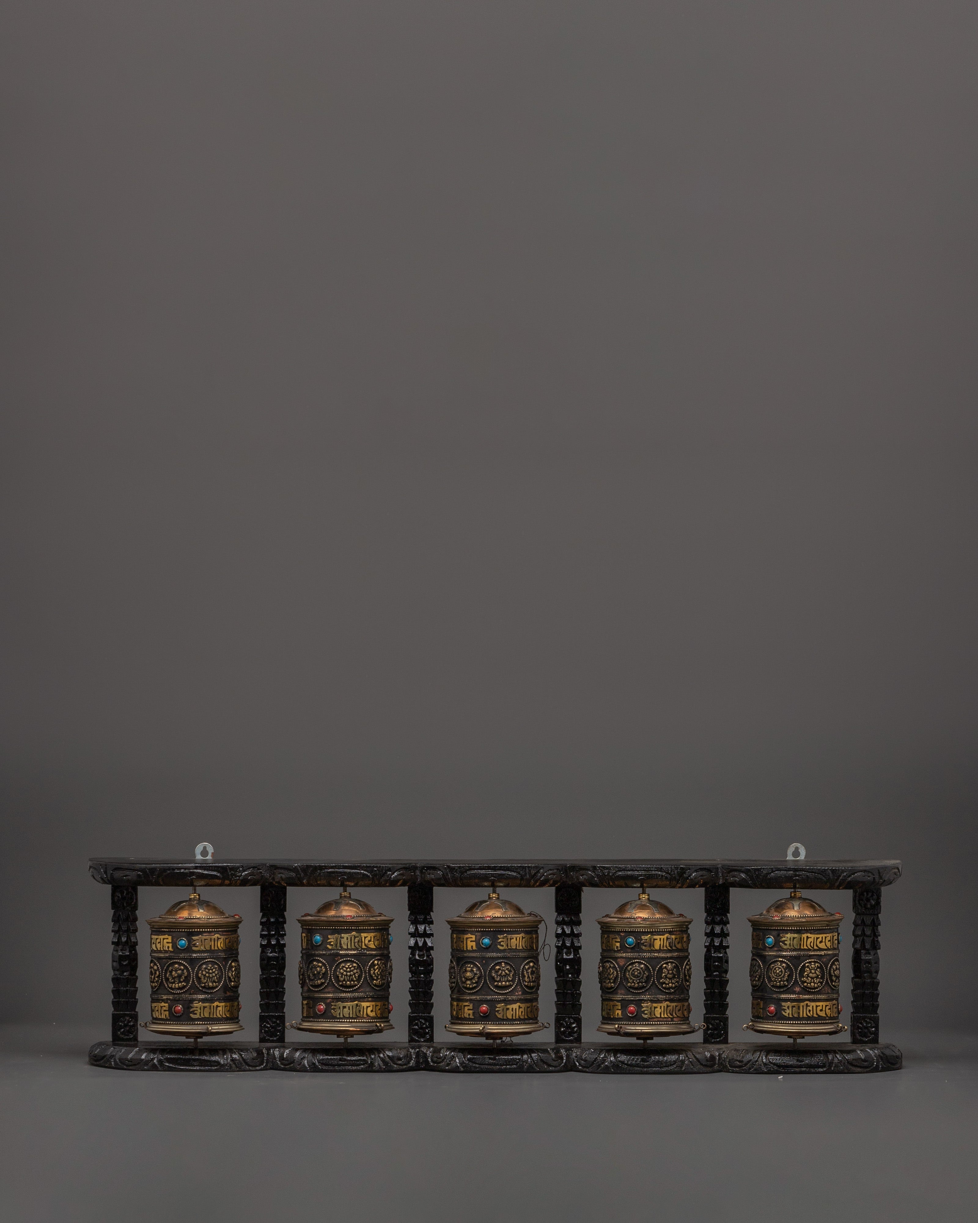Five Tibetan Prayer Wheels on a Wooden Frame
