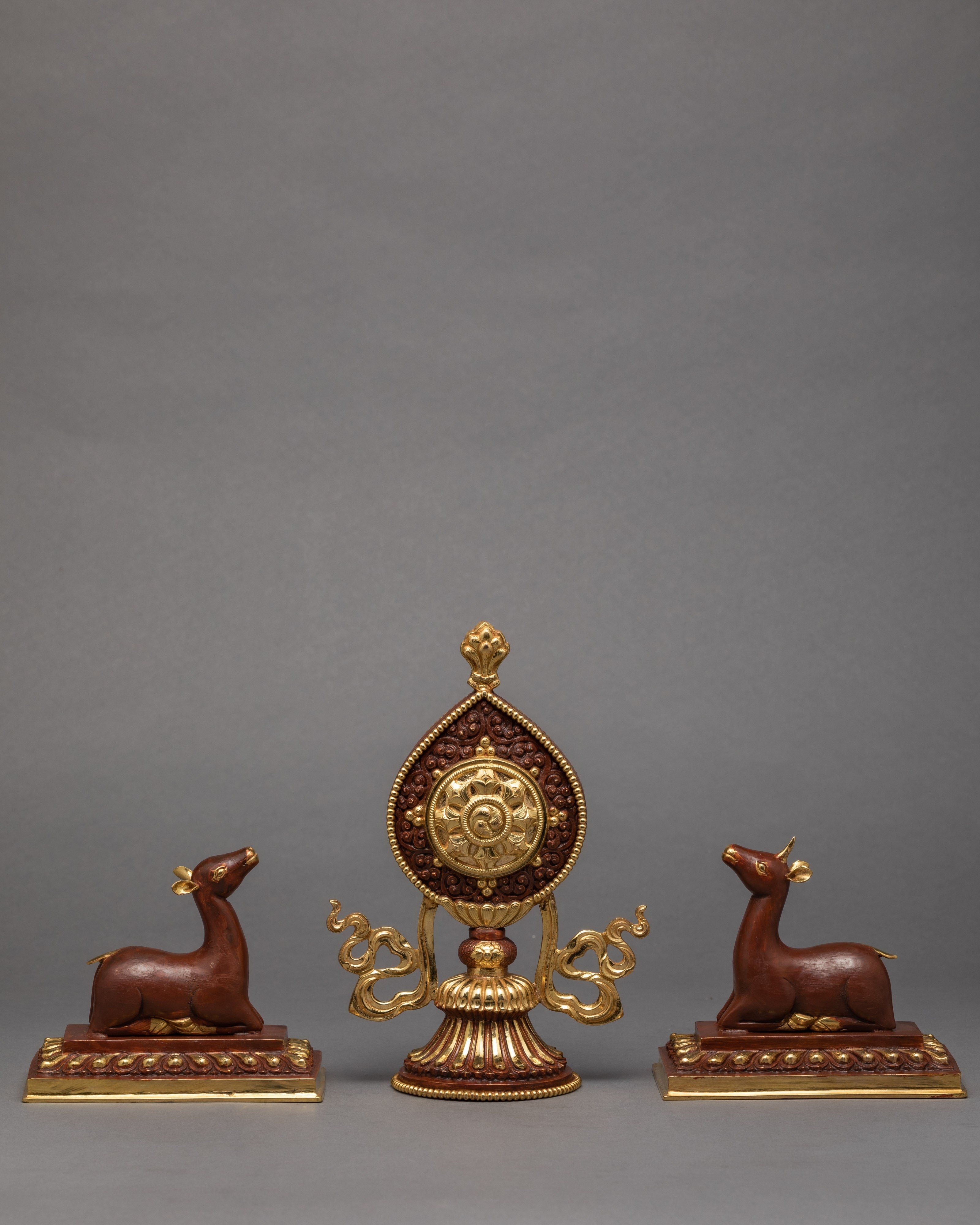 Wheel Of The Law And A Pair Of Crouching Deer