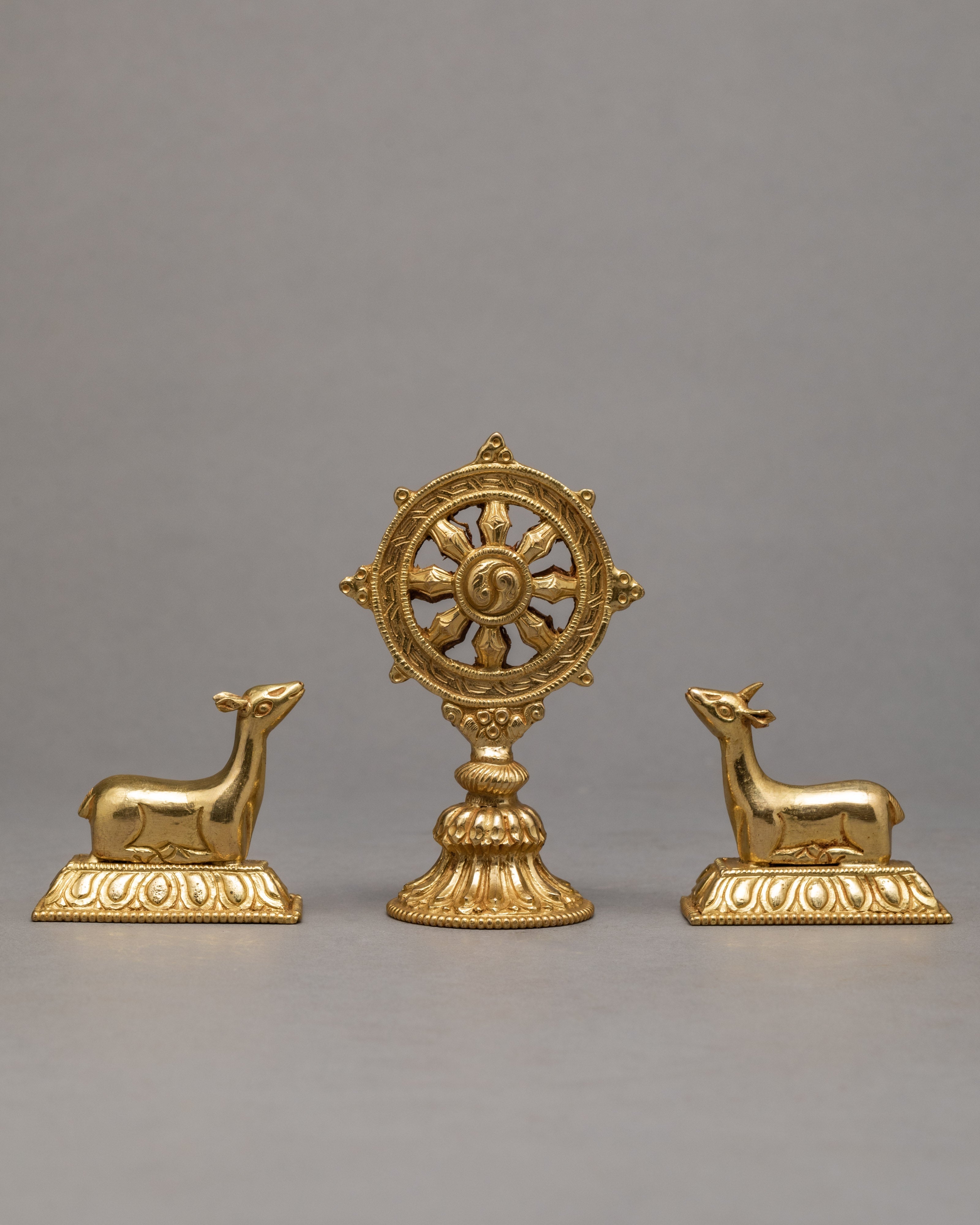 Wheel Of The Law And A Pair Of Crouching Deer