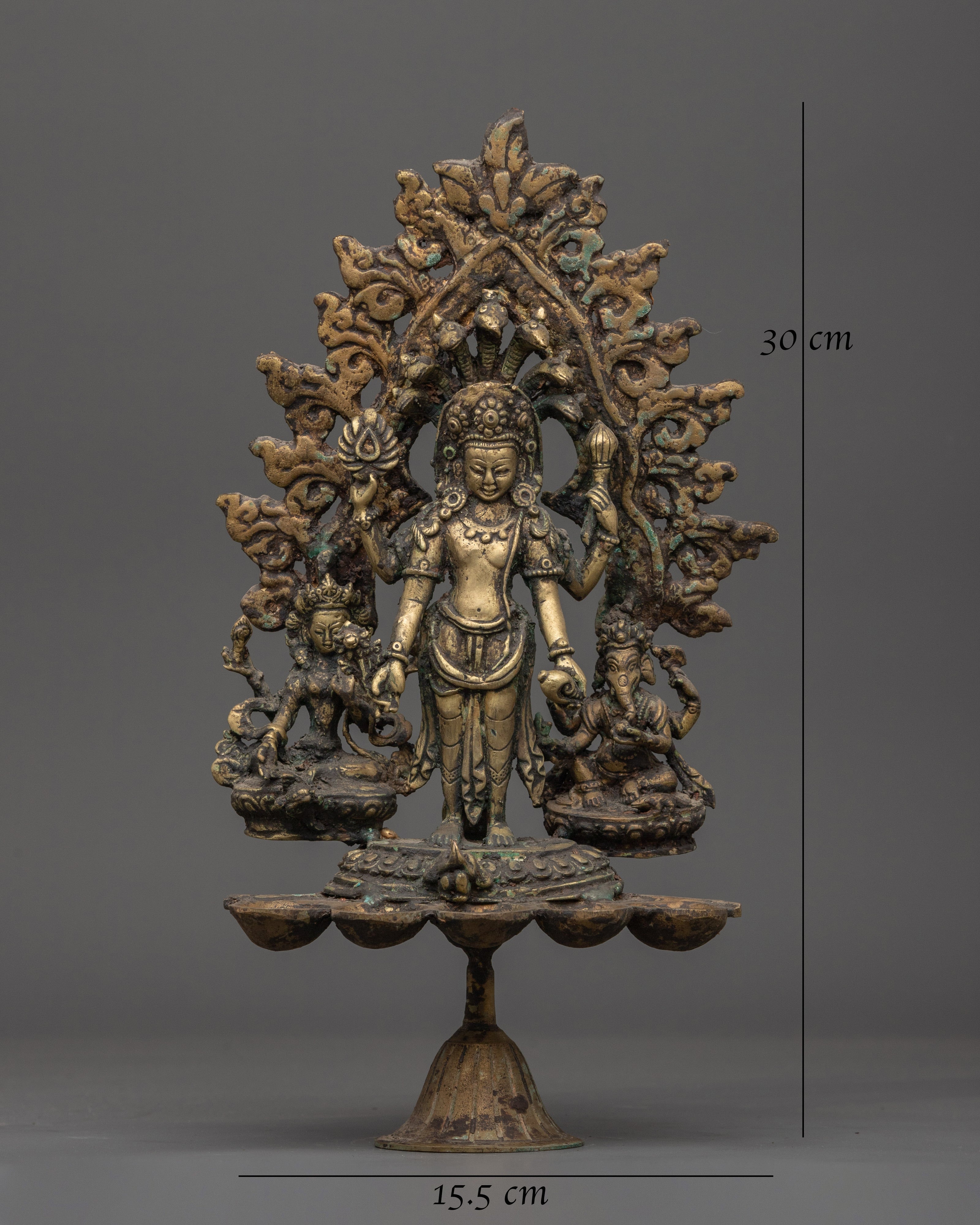 Brass Oil Lamp - Decorated with Avalokiteshvara, Vasudhara & Ganesh