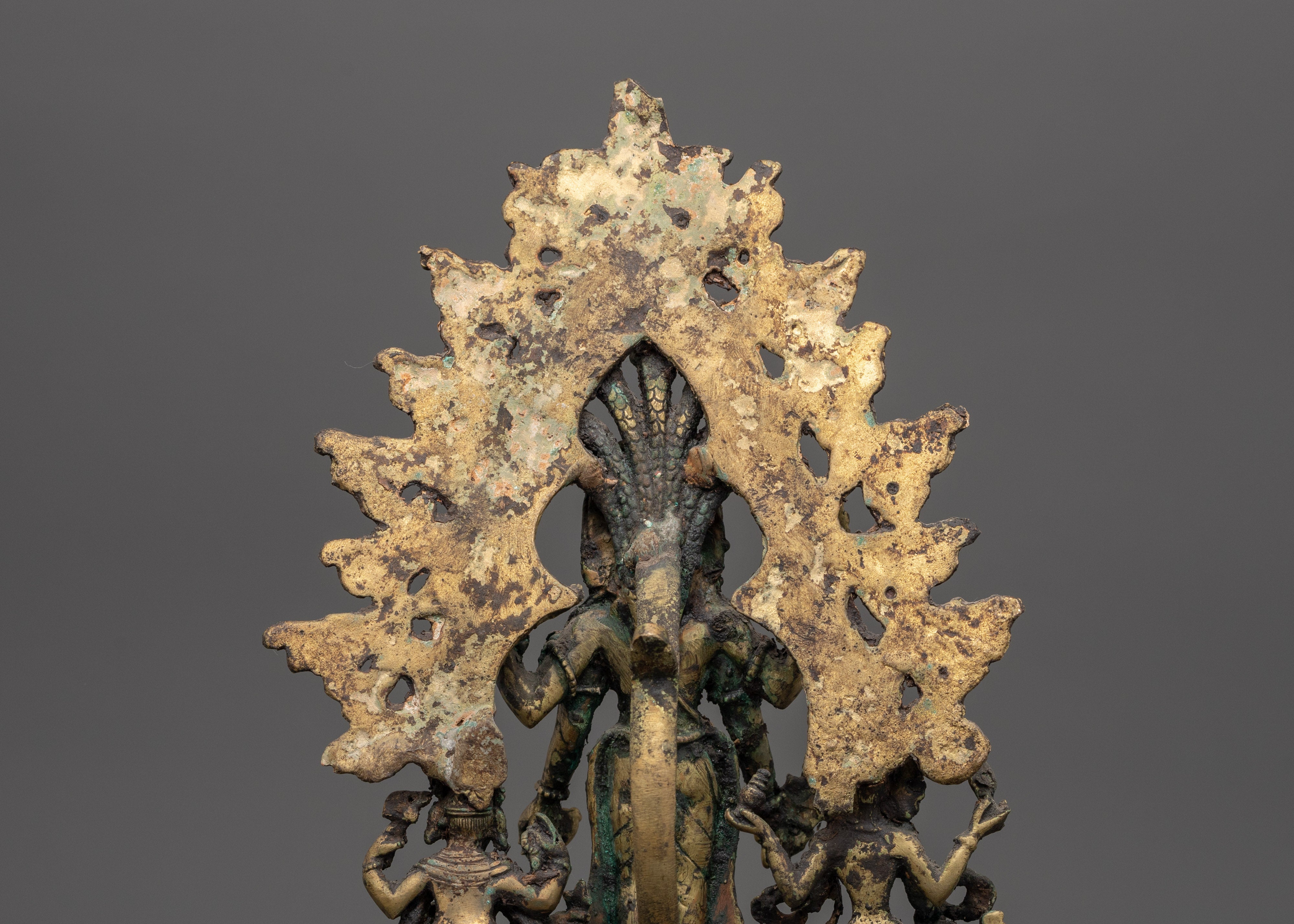 Brass Oil Lamp - Decorated with Avalokiteshvara, Vasudhara & Ganesh