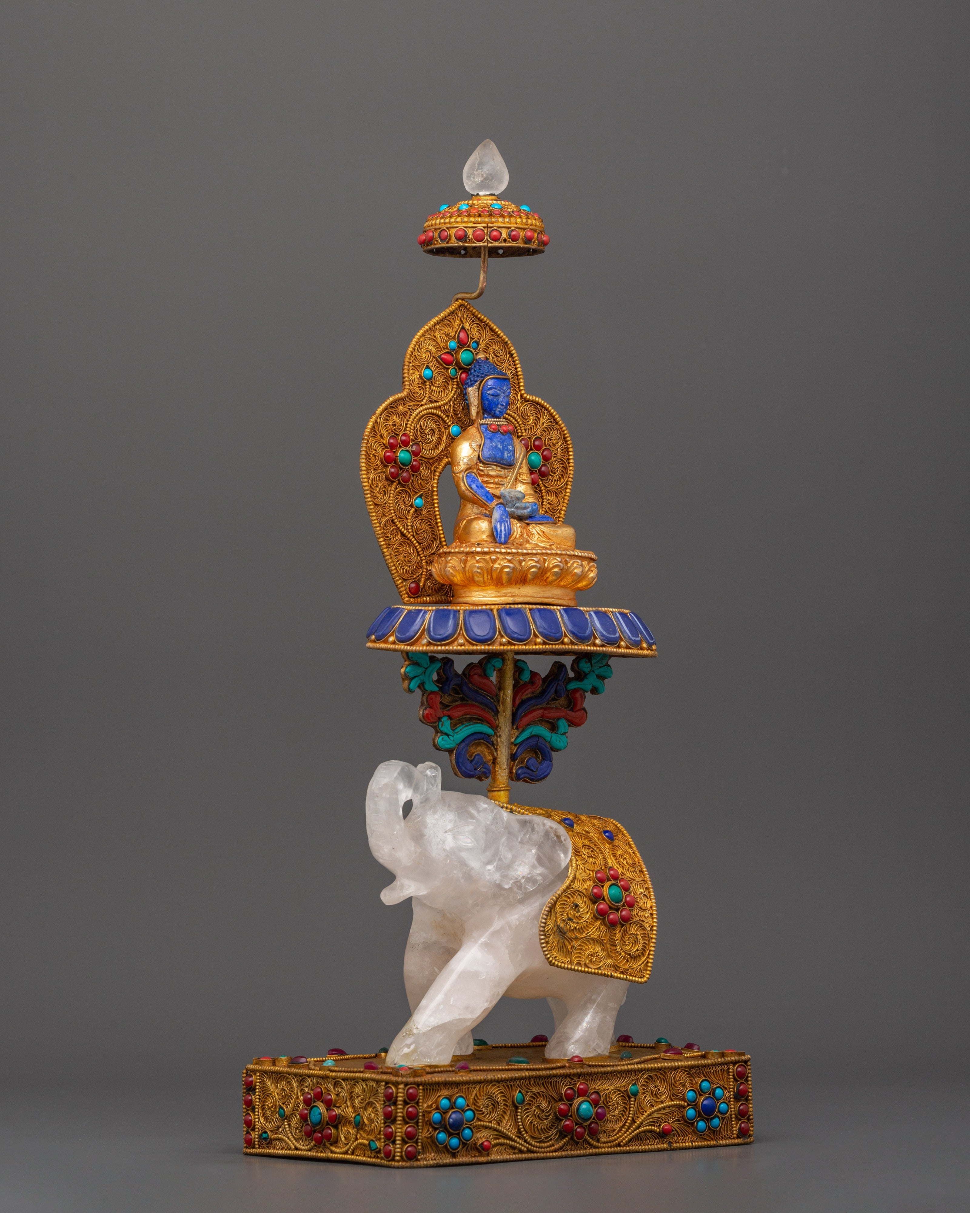 Shakyamuni Buddha on Crystal Elephant | Lapis & Coral Inlaid Gold Statue