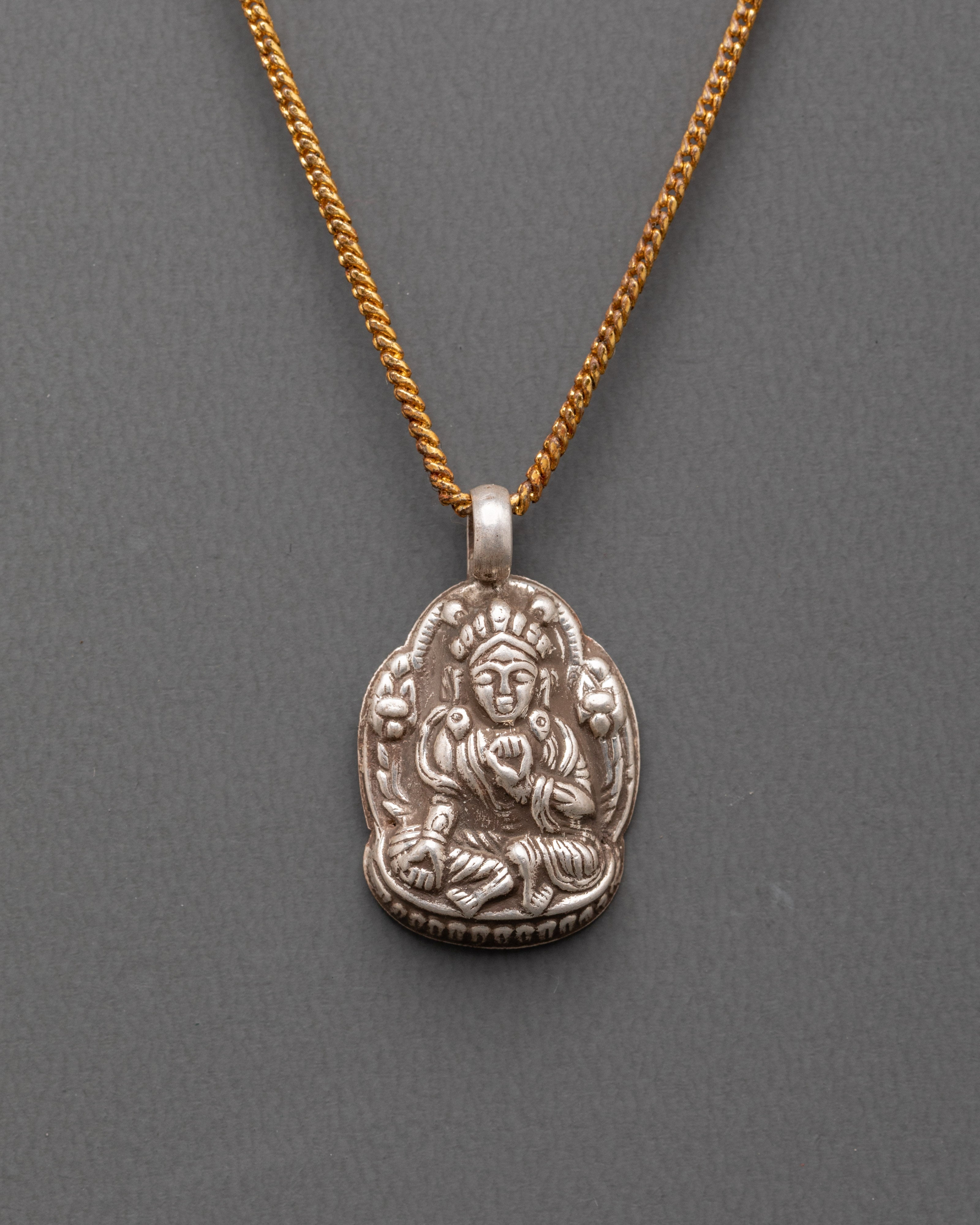 Handcrafted Buddhist deity pendant