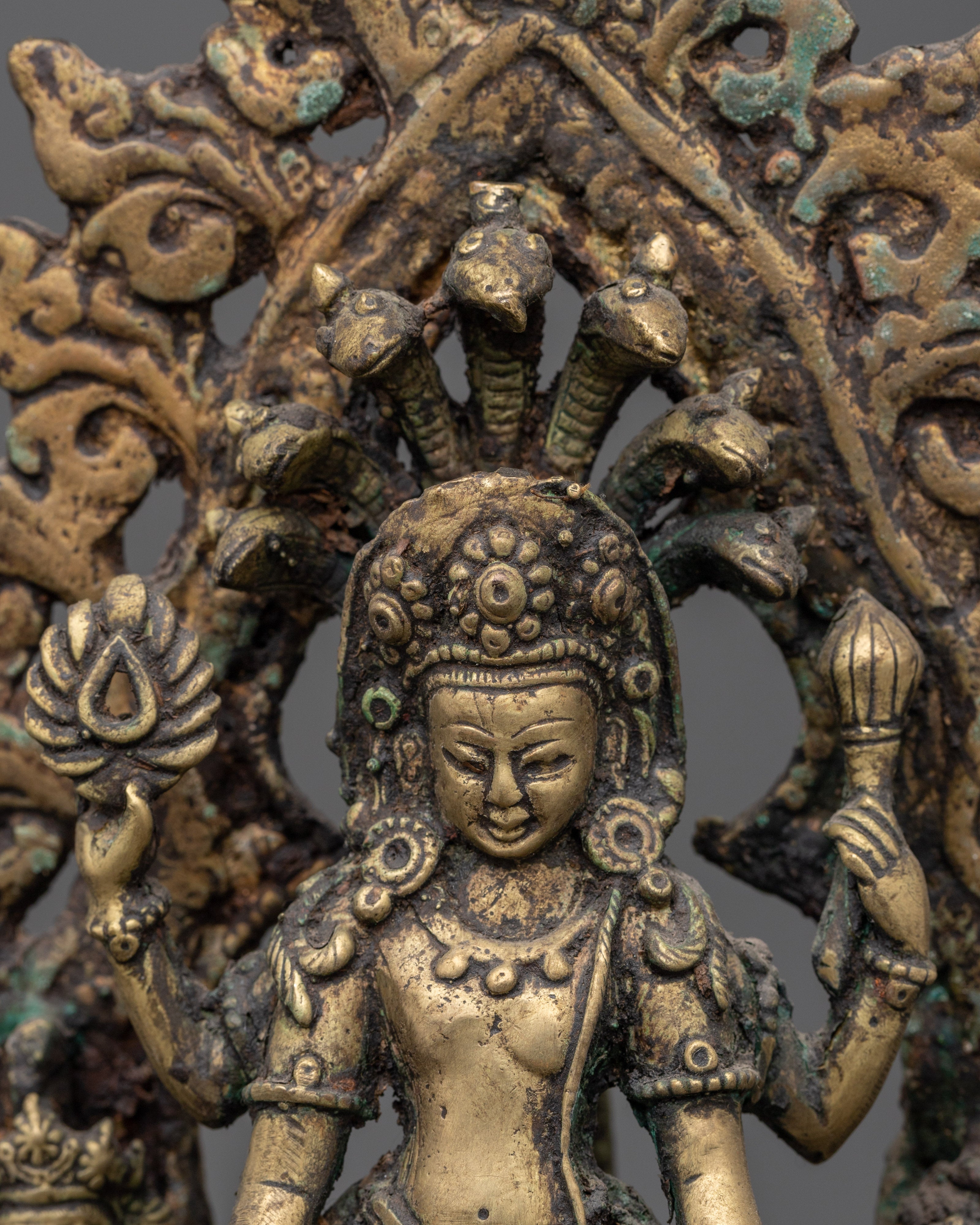 Brass Oil Lamp - Decorated with Avalokiteshvara, Vasudhara & Ganesh