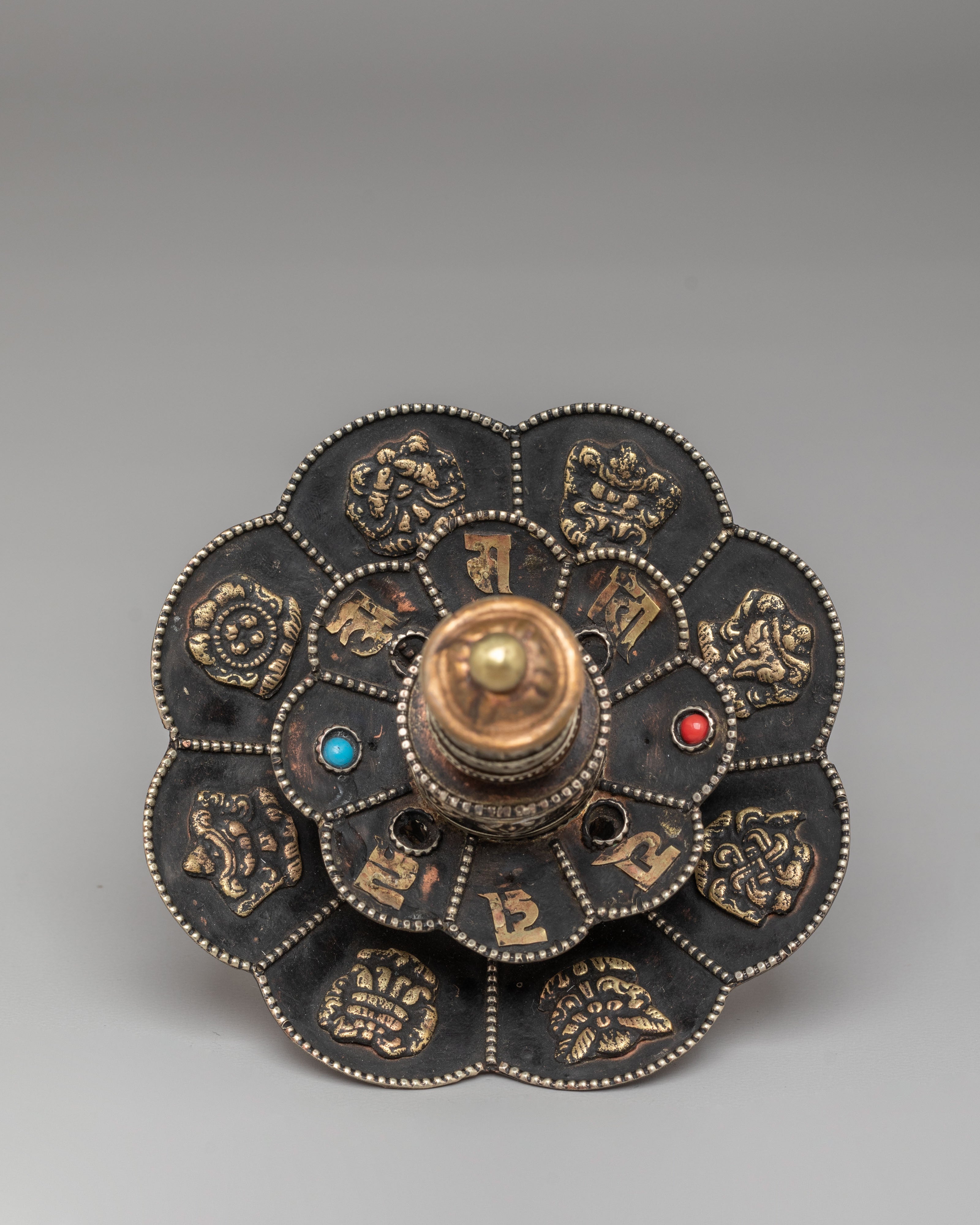 Tibetan Prayer Wheel on Floral Base | Spiritual Symbol of Compassion and Blessings