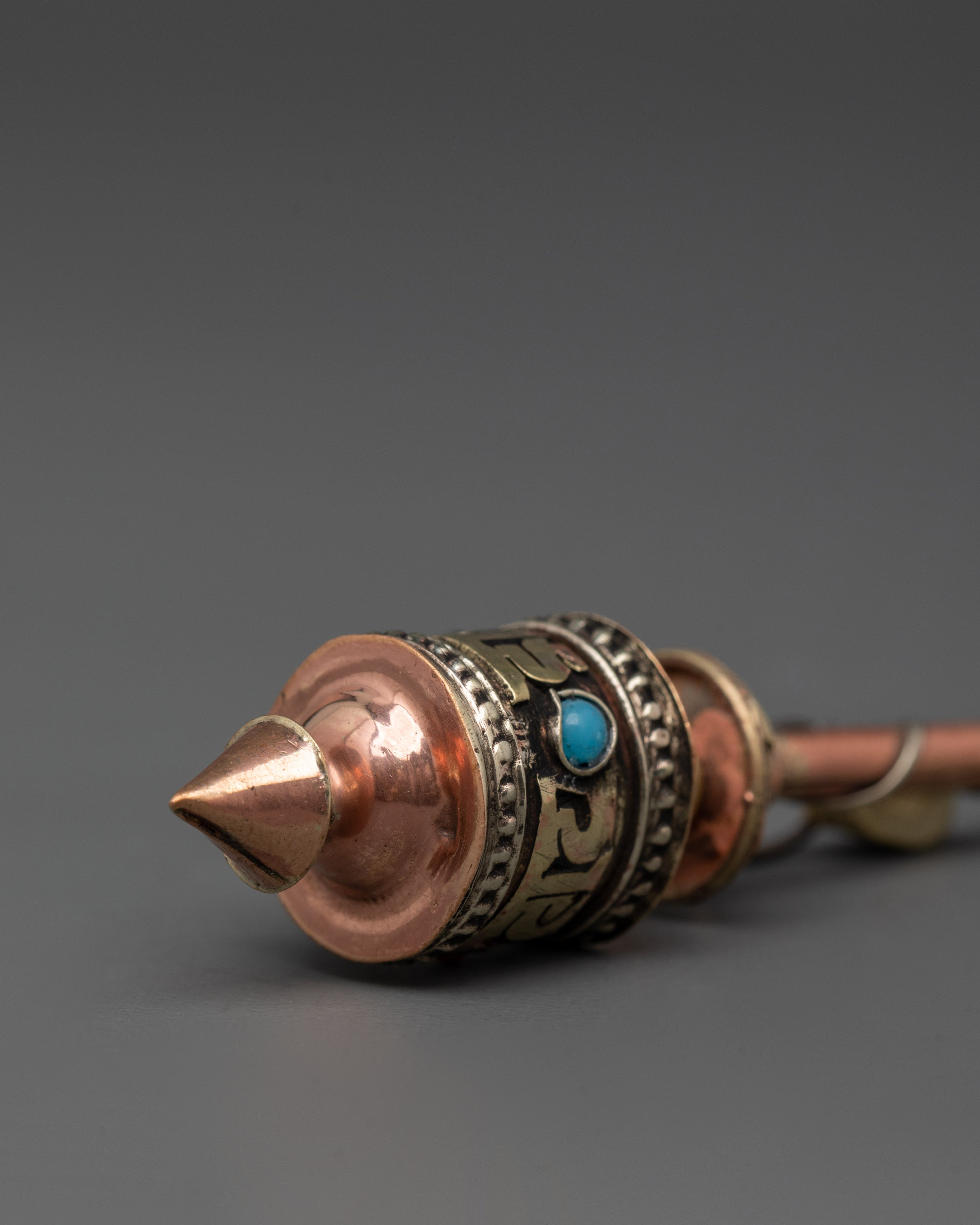 Handheld Tibetan prayer wheel in copper | Mindfulness & Spiritual Practice