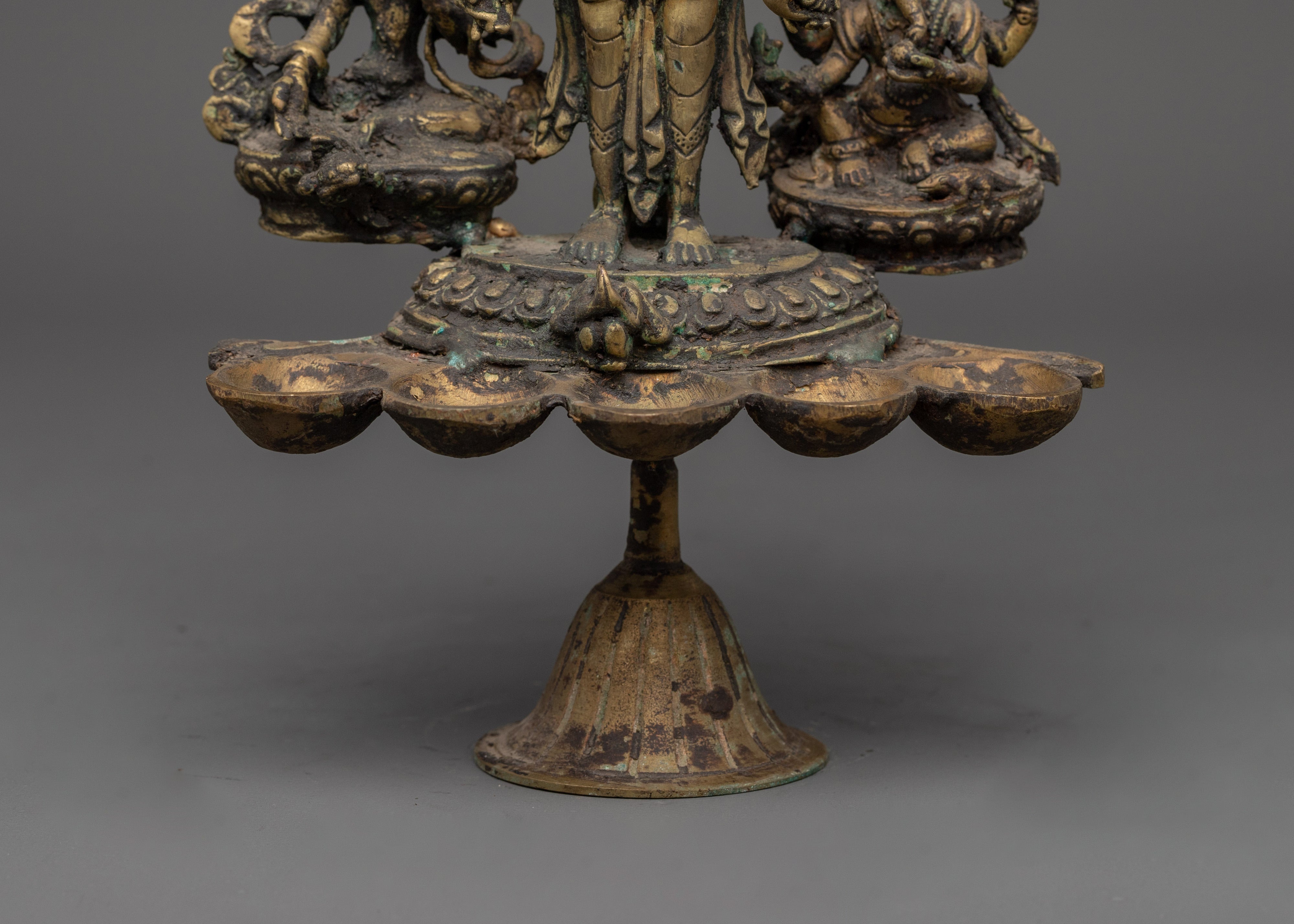 Brass Oil Lamp - Decorated with Avalokiteshvara, Vasudhara & Ganesh