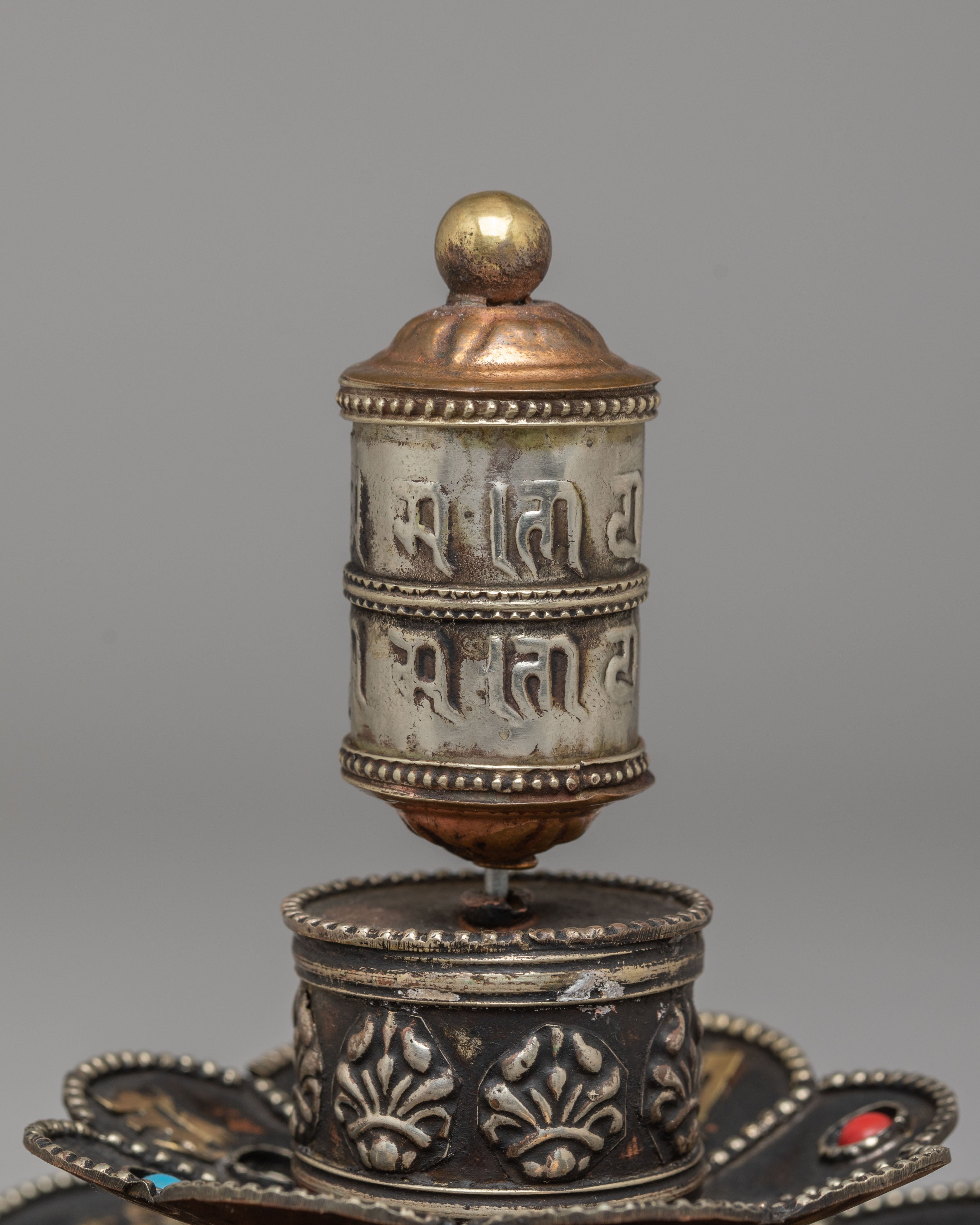Tibetan Prayer Wheel on Floral Base | Spiritual Symbol of Compassion and Blessings