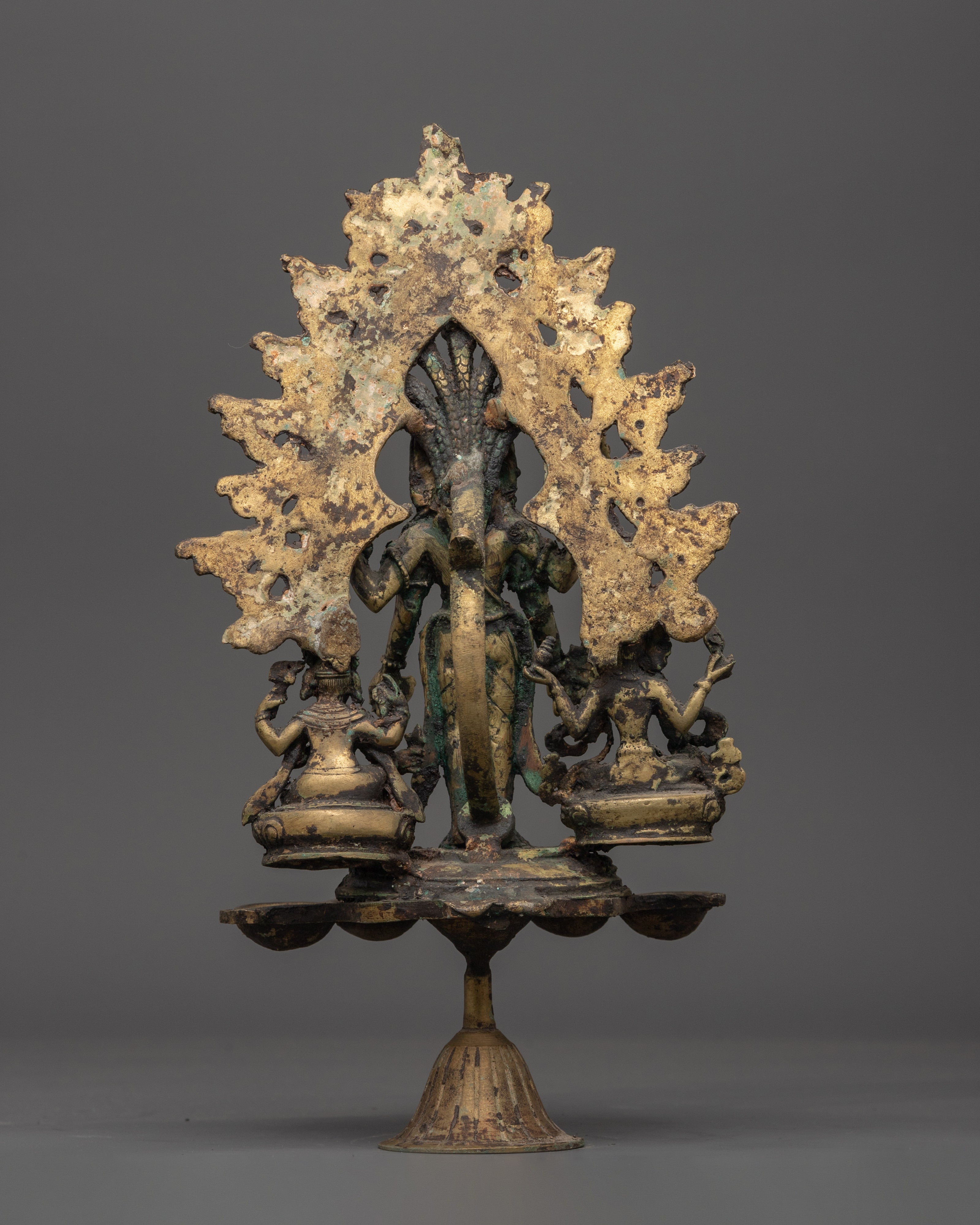 Brass Oil Lamp - Decorated with Avalokiteshvara, Vasudhara & Ganesh