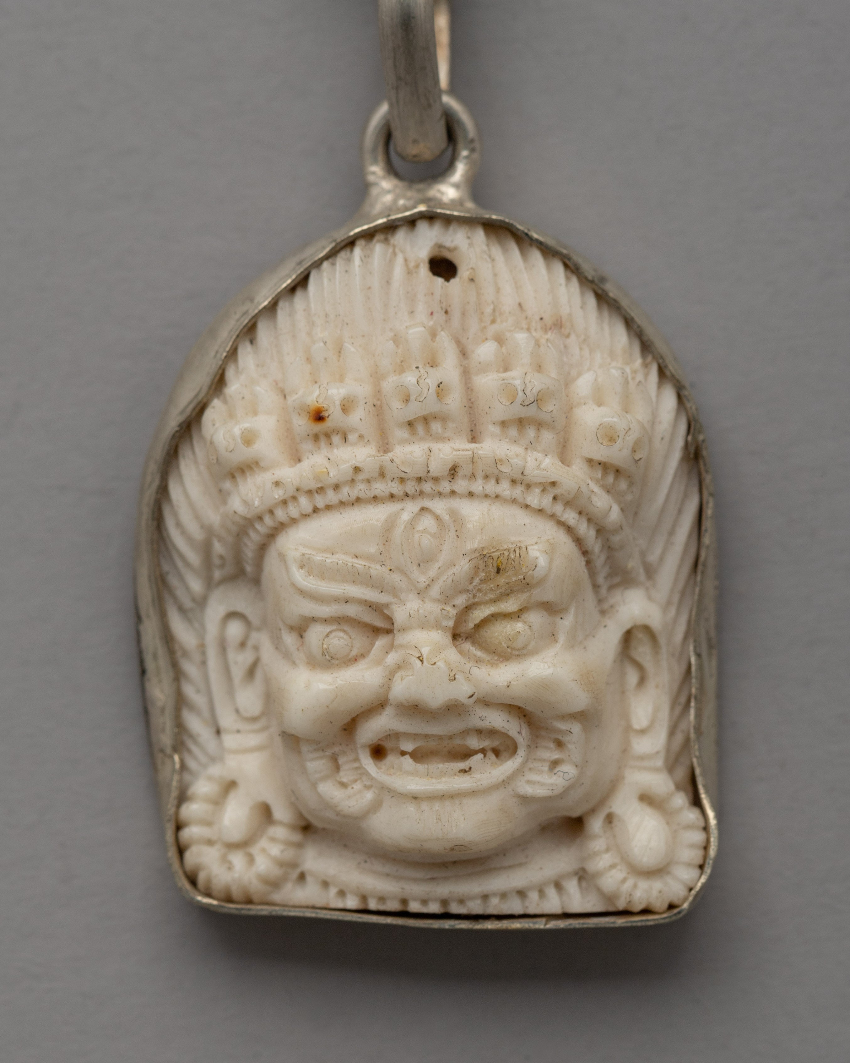 Hand-Carved Bhairav Locket with Five-Skull Crown | Buffalo Bone & White Metal
