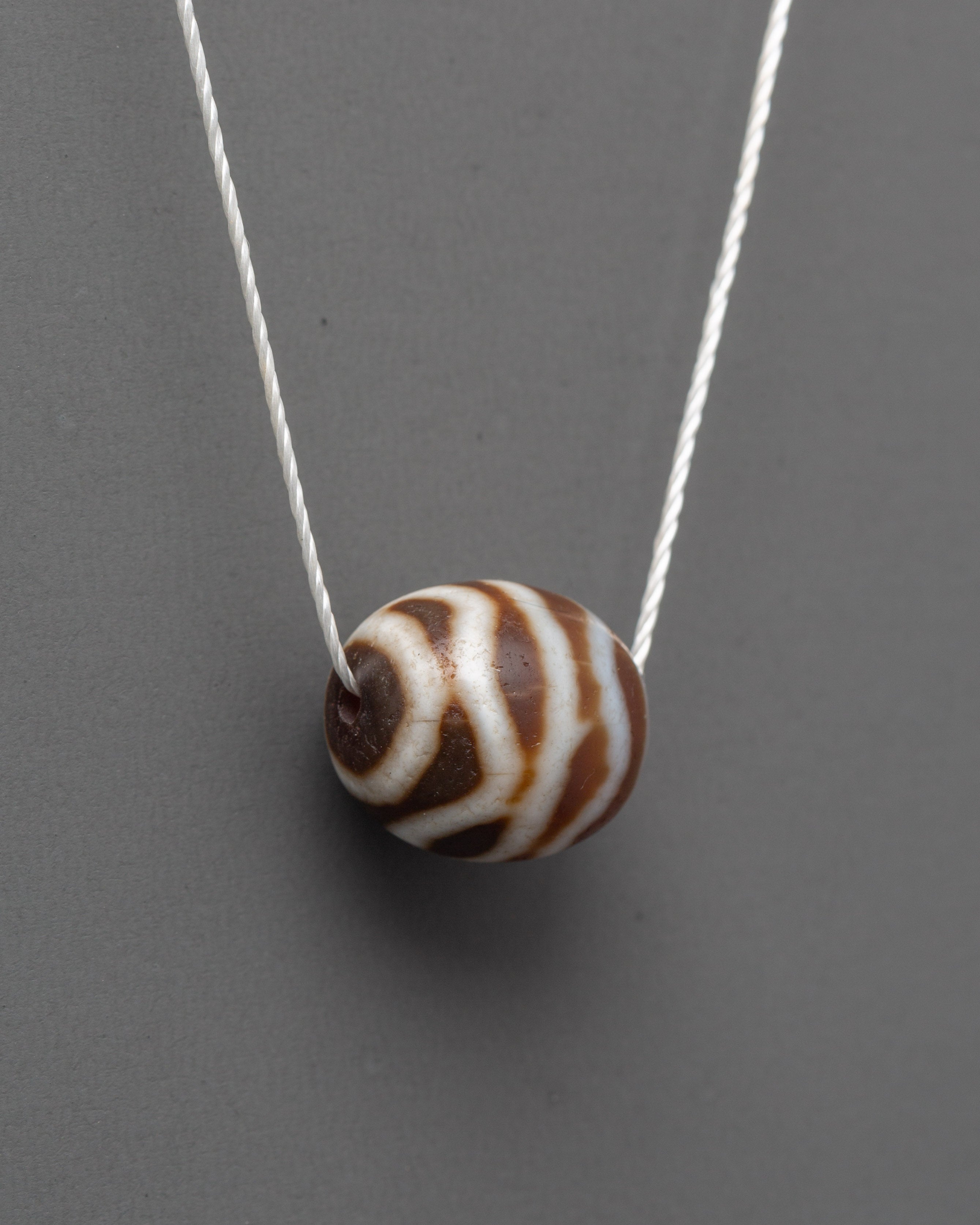 Sacred Tibetan Dzi Bead Locket | Spiritual Pendant for Protection and Blessings