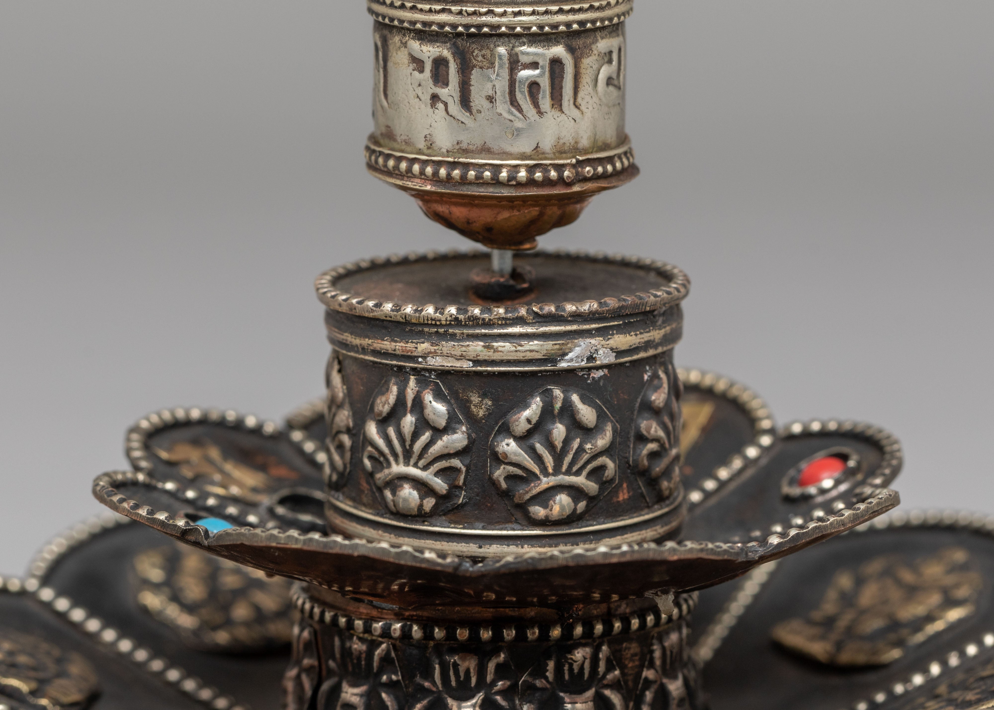 Tibetan Prayer Wheel on Floral Base | Spiritual Symbol of Compassion and Blessings