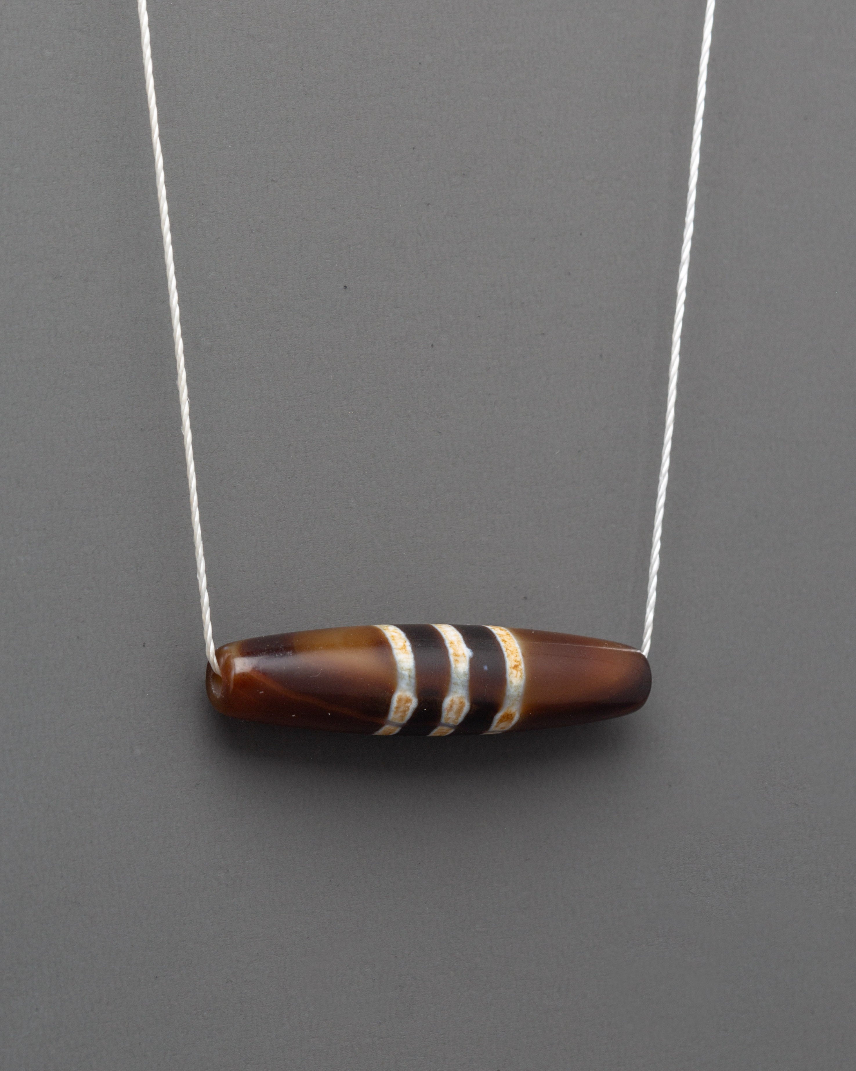 Dzi Bead Jewelry | Sacred Amulet for Protection