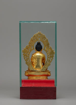 Glass-Enclosed Shakyamuni Buddha Statue | Meditative Lotus Pedestal Figure