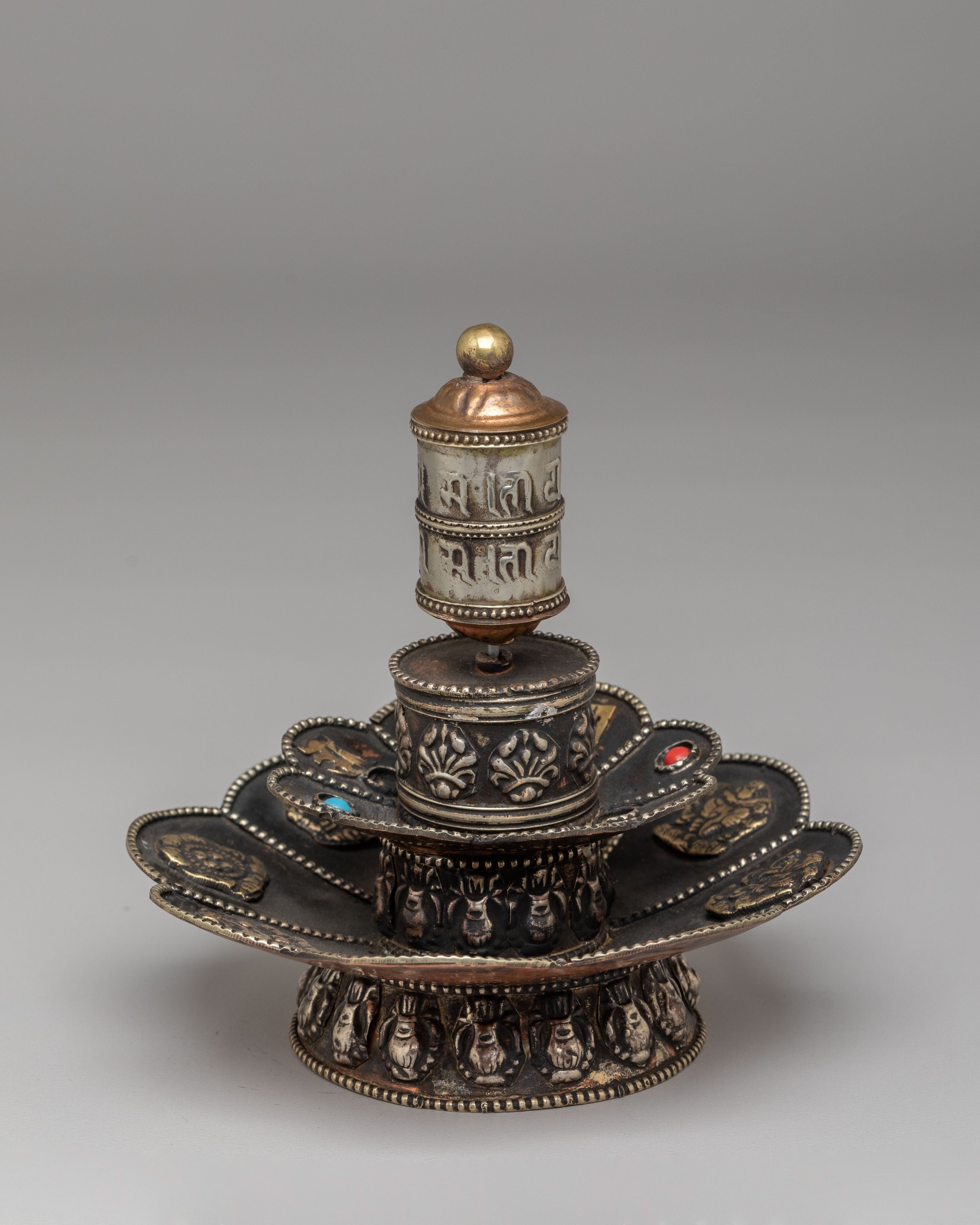 Tibetan Prayer Wheel on Floral Base | Spiritual Symbol of Compassion and Blessings