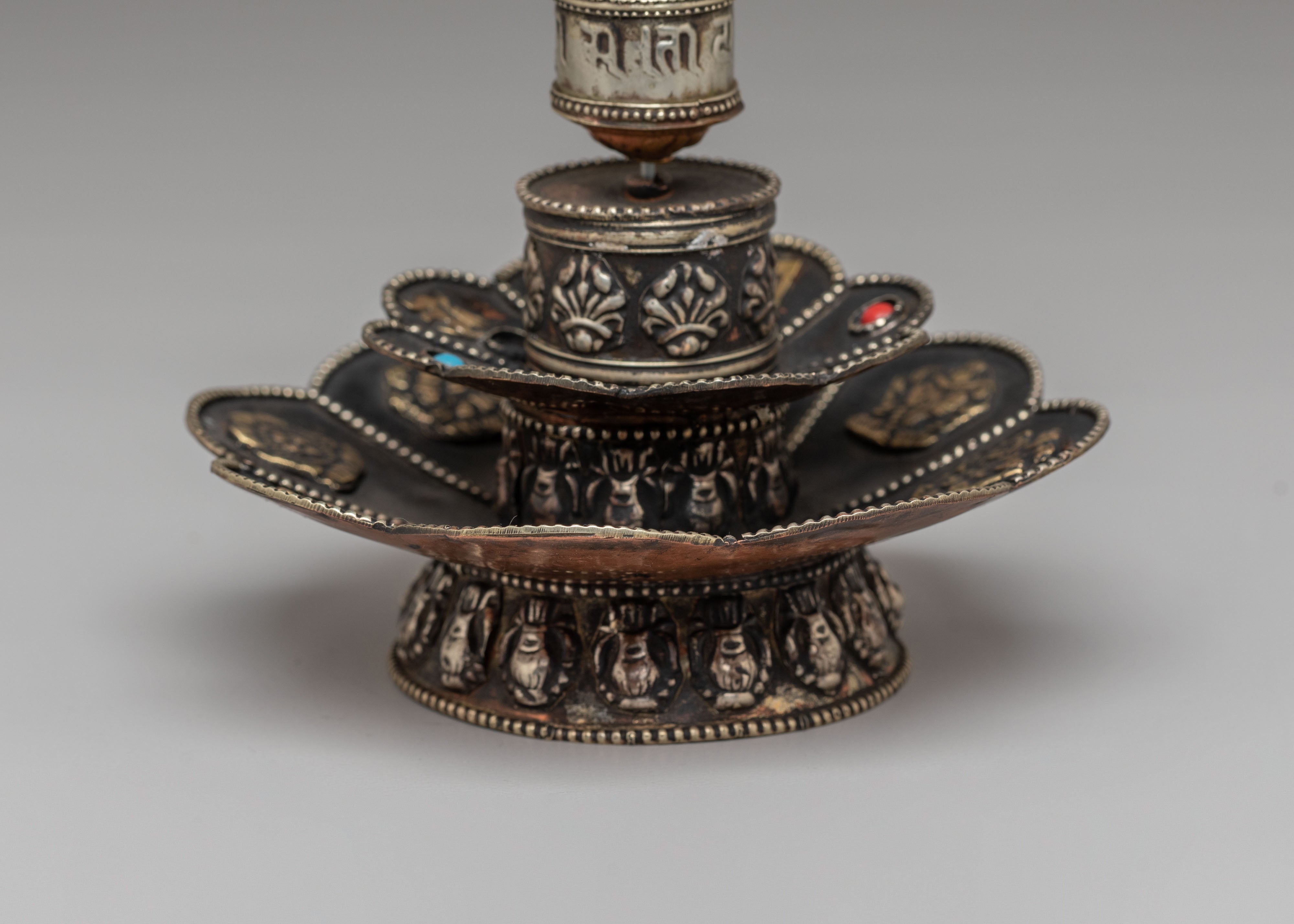 Tibetan Prayer Wheel on Floral Base | Spiritual Symbol of Compassion and Blessings