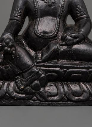 Dzambhala Oxidized Stone Statue | A Symbol of Wealth